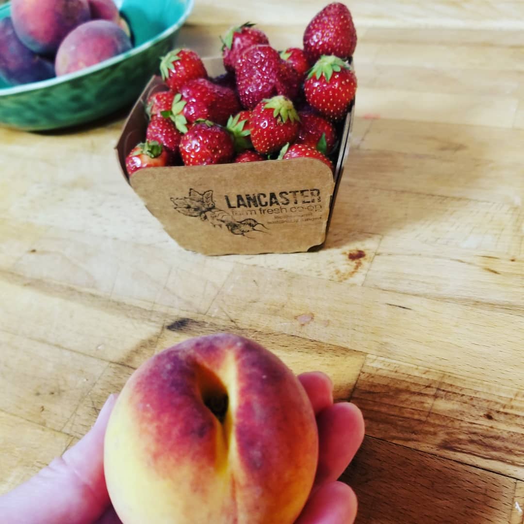 first local peach + last of the strawberries 6.16.20